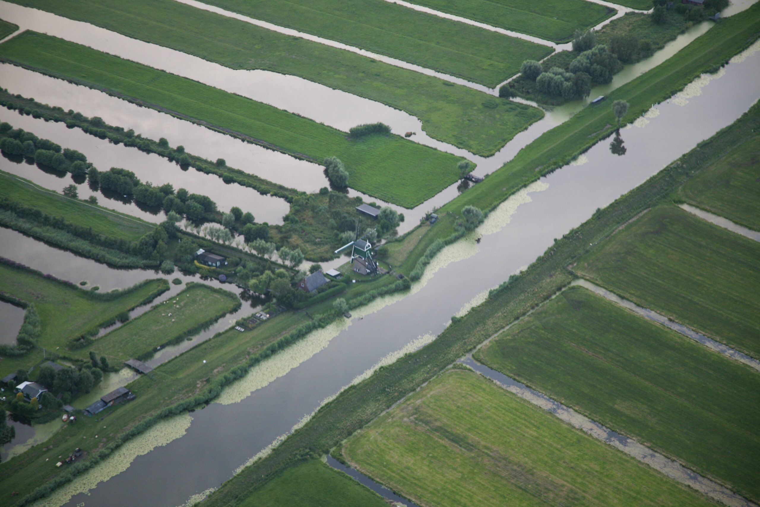 High Angle Shot Water Stream Middle Grassy Field Dutch Polder Scaled